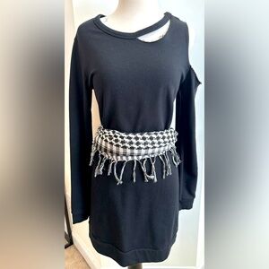 Long sleeve cutout mini dress.